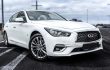 Infiniti,Q50,In,A,White,Color,In,The,Parking,Lot.